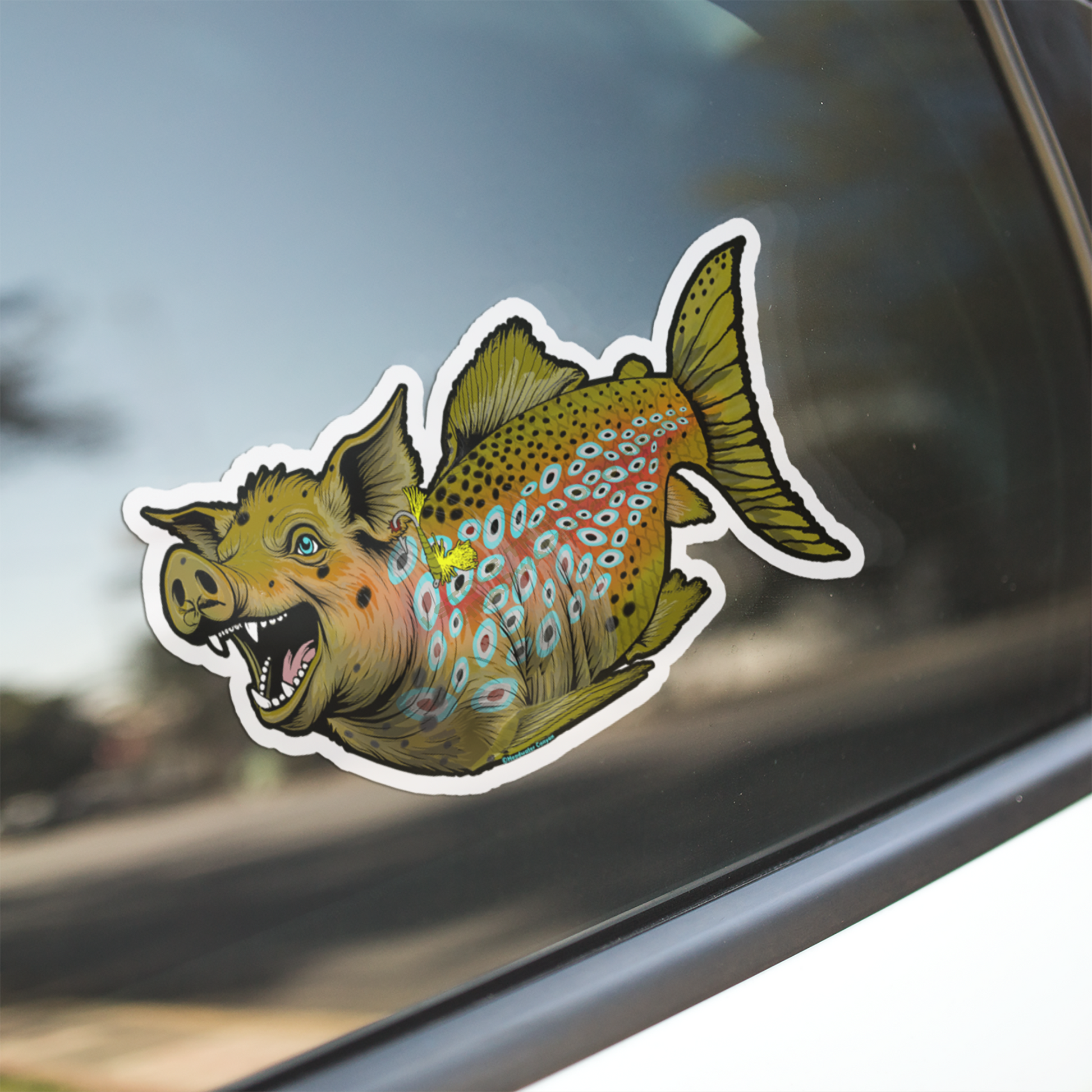 Picture of the Headwater Canyon Boss Hog fly fishing decal on a vehicle window.  pig crossed with a brown trout trophy fish. Waterproof sticker.