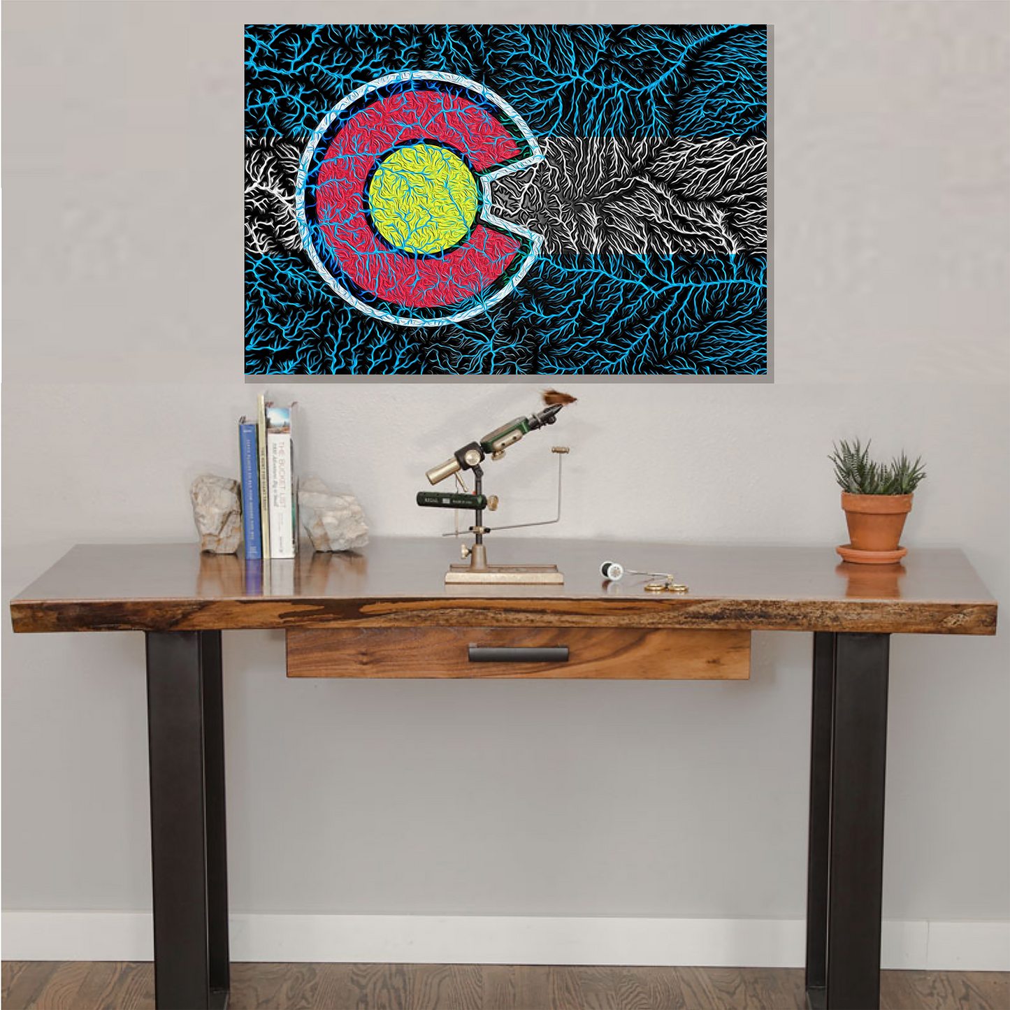 Colorado Watersheds Canvas Art on a wall behind fly fishing tying desk and vice.  A