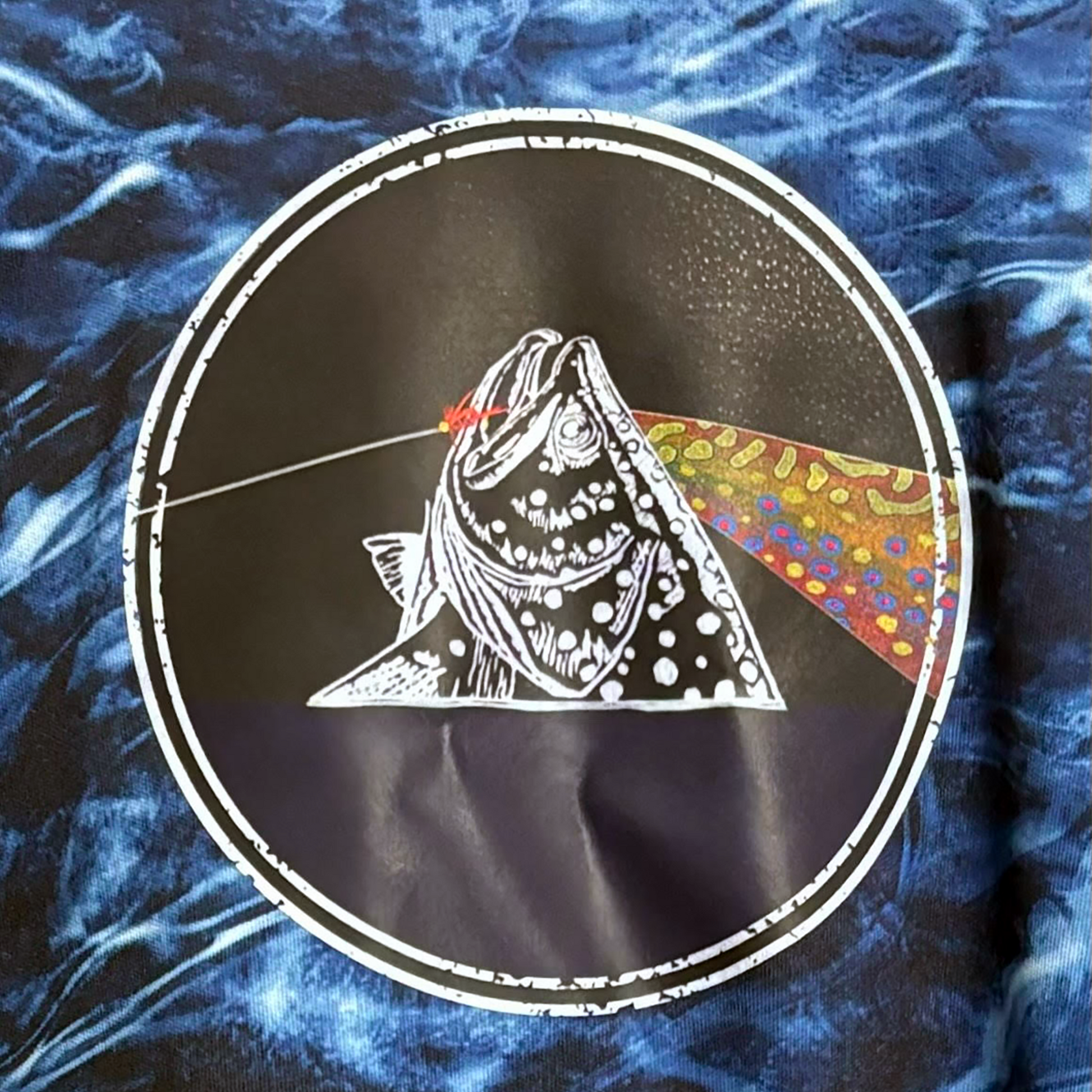 Mossy Oak Blue Sun Hoodie for fly fishing.  The Headwater Canyon Fish You Were Here sun protection hooded performance shirt features a fly fishing line catching a trout.  Pink Floyd Dark Side of the Moon Close Up Hoodie.