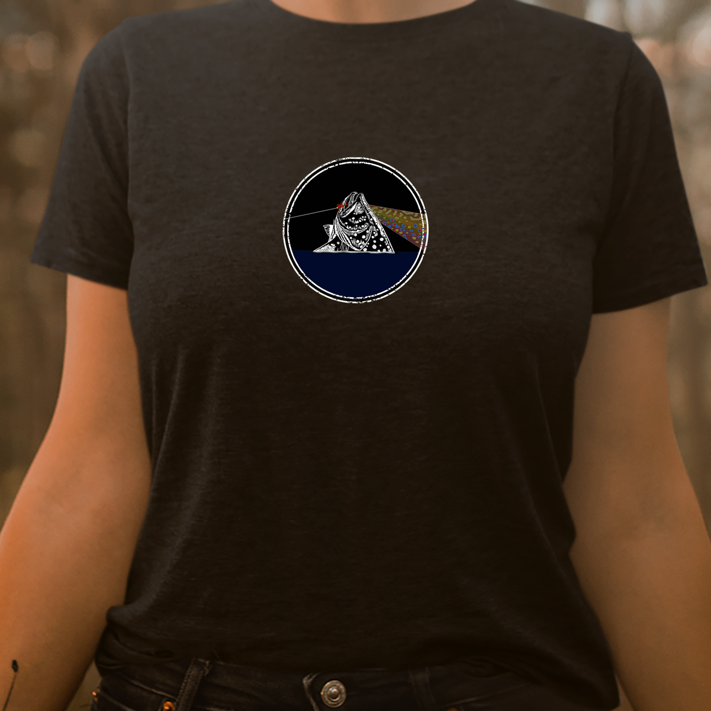 Women's fly fishing t shirt.  Black colored women's tee.  Fish You Were Here Tee by Headwater Canyon.  Fly fishing shirt depicts Pink Floyd Dark Side of the Moon t shirt on a woman.