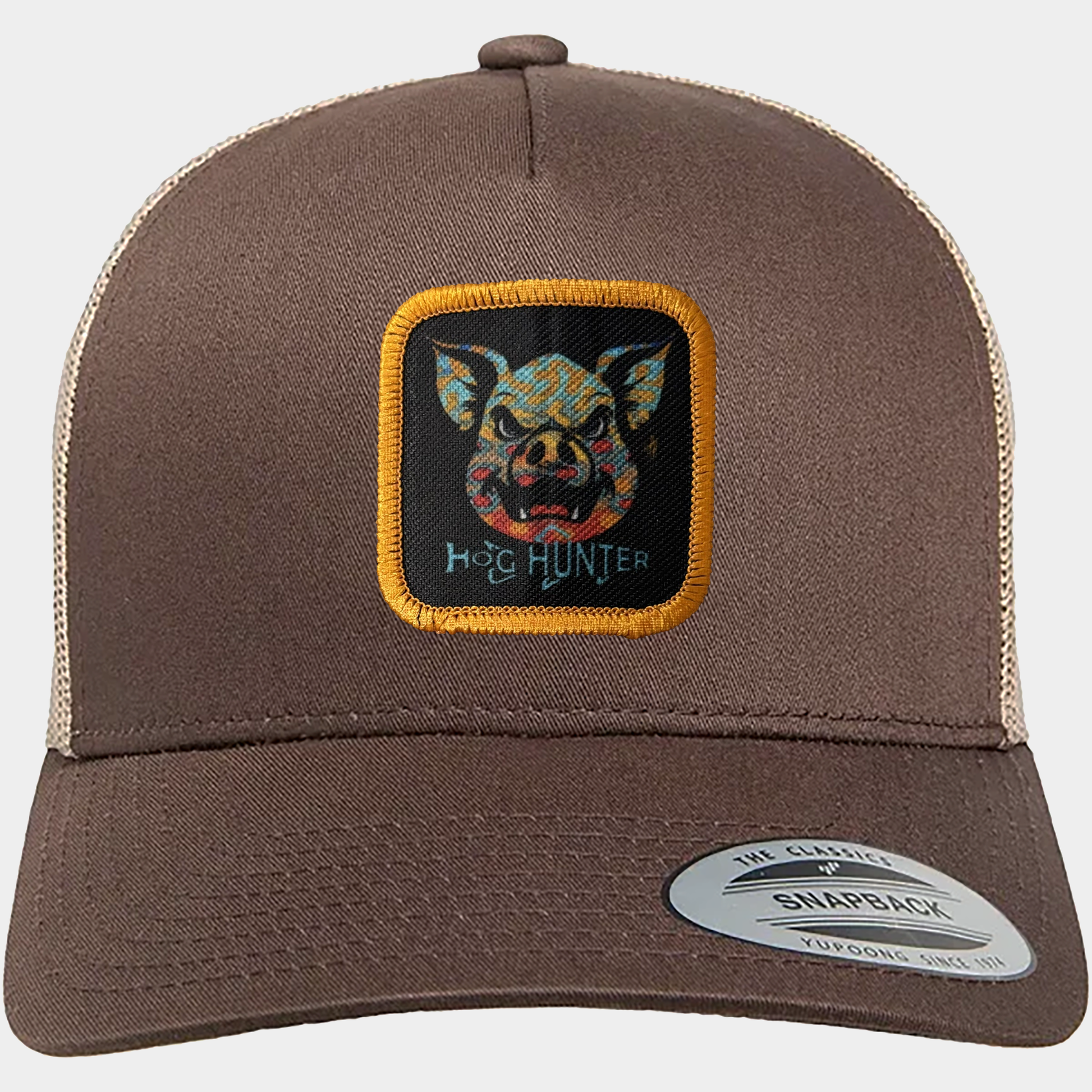 The coyote brown trucker hat features the Headwater Canyon Hog Hunter graphic with brook trout pattern