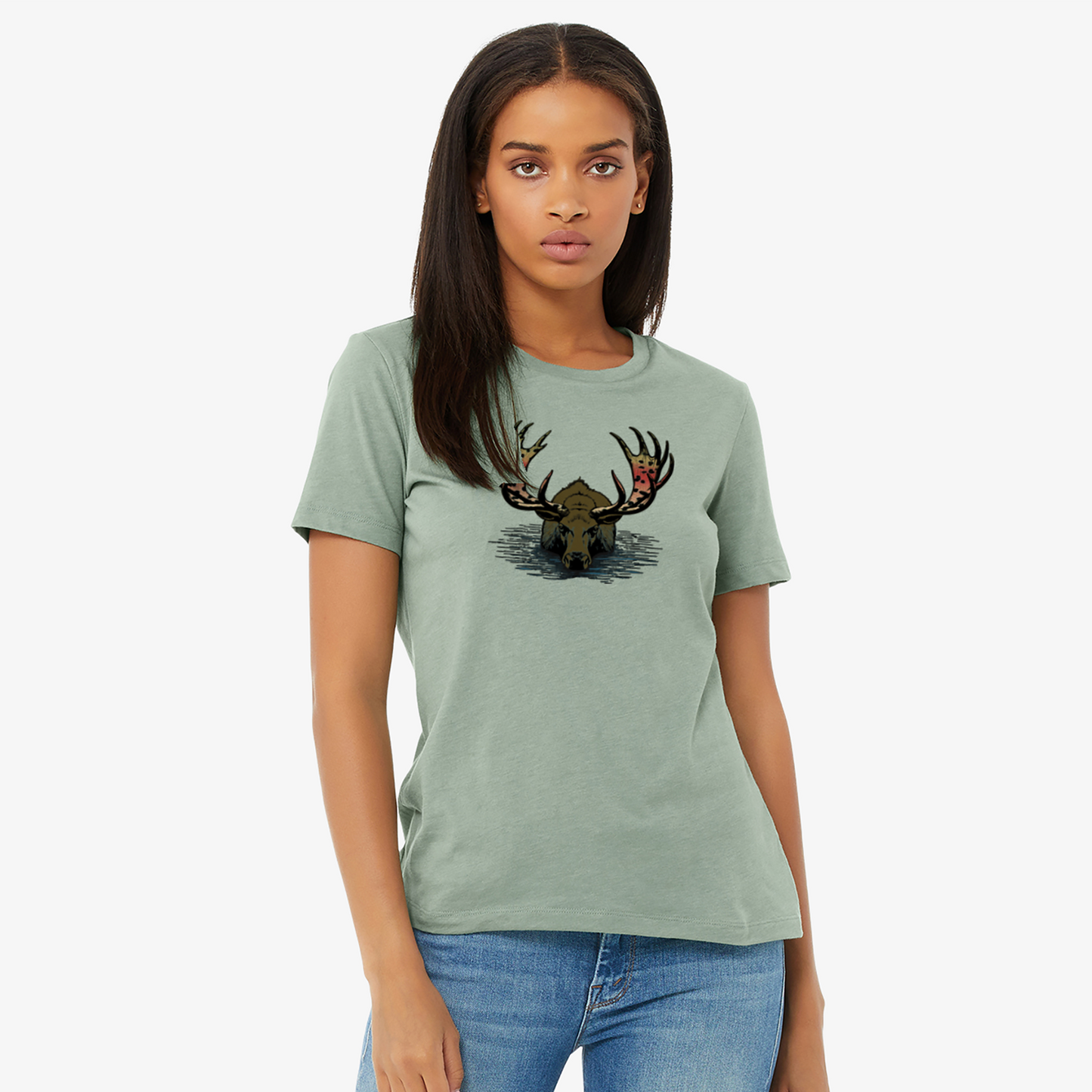 Women's fly fishing t shirt.  Sage colored women's tee.  Rainbull Tee by Headwater Canyon.  Fly fishing shirt depicts a moose in the water with a rainbow trout pattern on his horns on a woman.