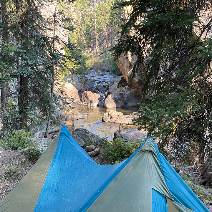A picture of a tent in the back country of Colorado on a fly fishing trip.