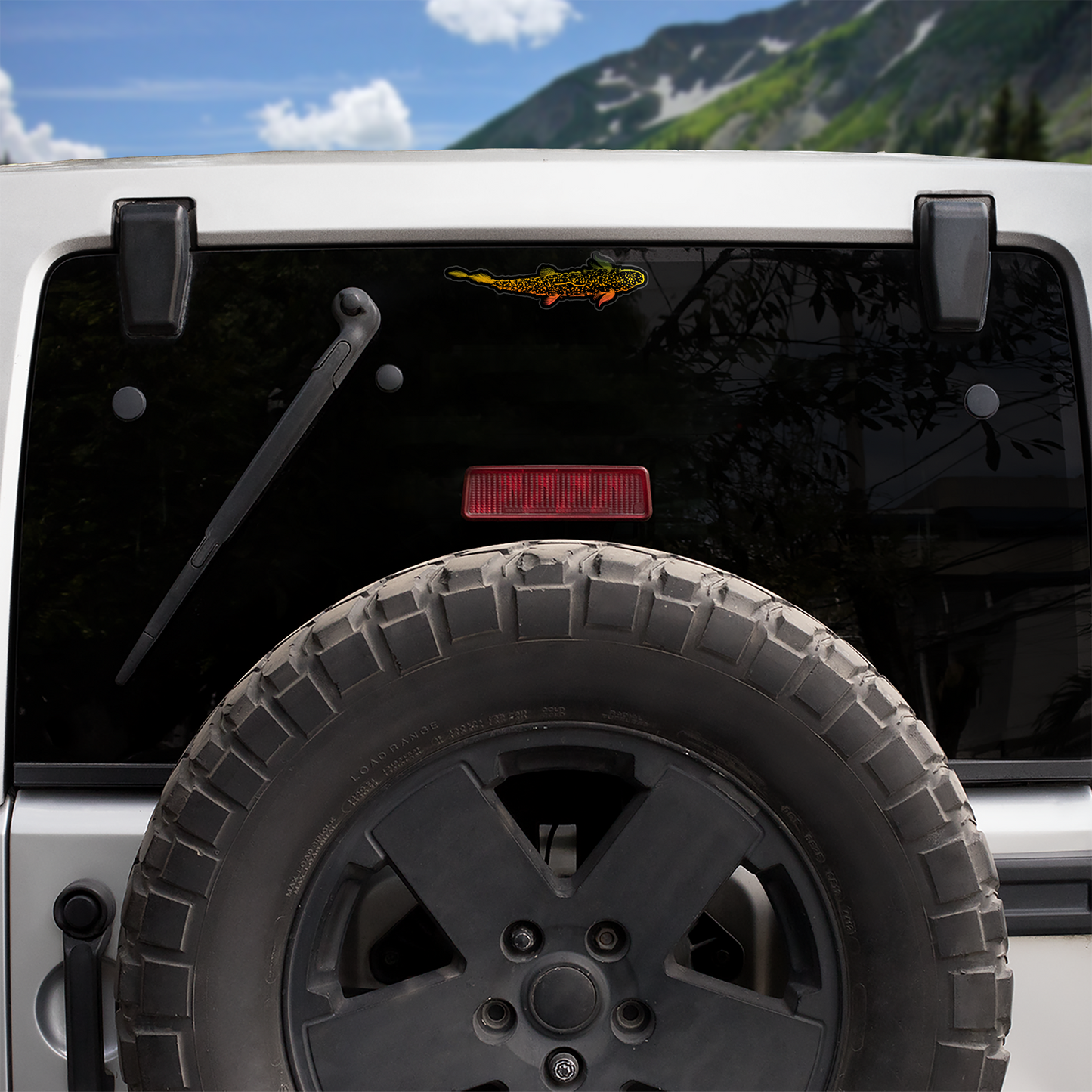 Picture of the Trout Is Fly fly fishing decal on the rear window of a jeep.  Headwater Canyon