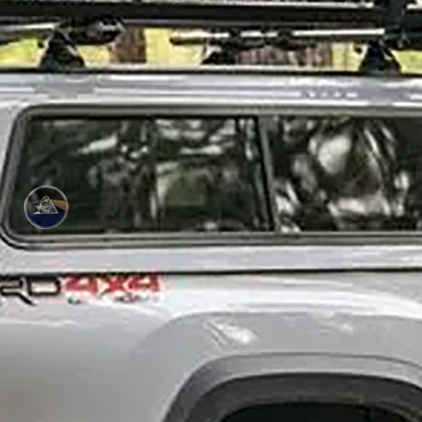 The Headwater Canyon Fish You Were Here decal on the side window of a Toyota truck.  Fly fishing decal.